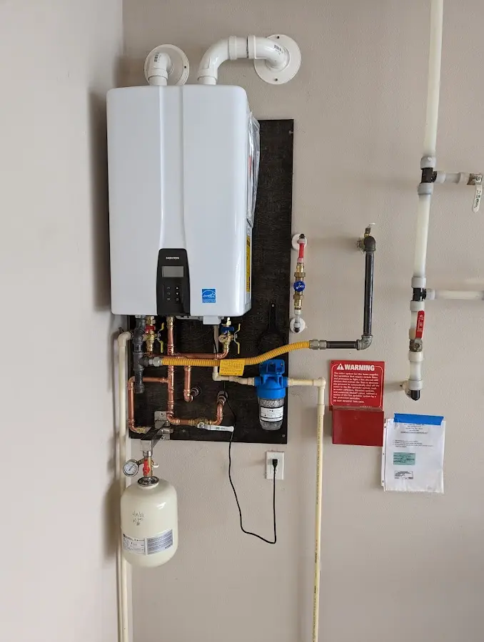 Professional plumber installing copper piping in a Wickliffe home